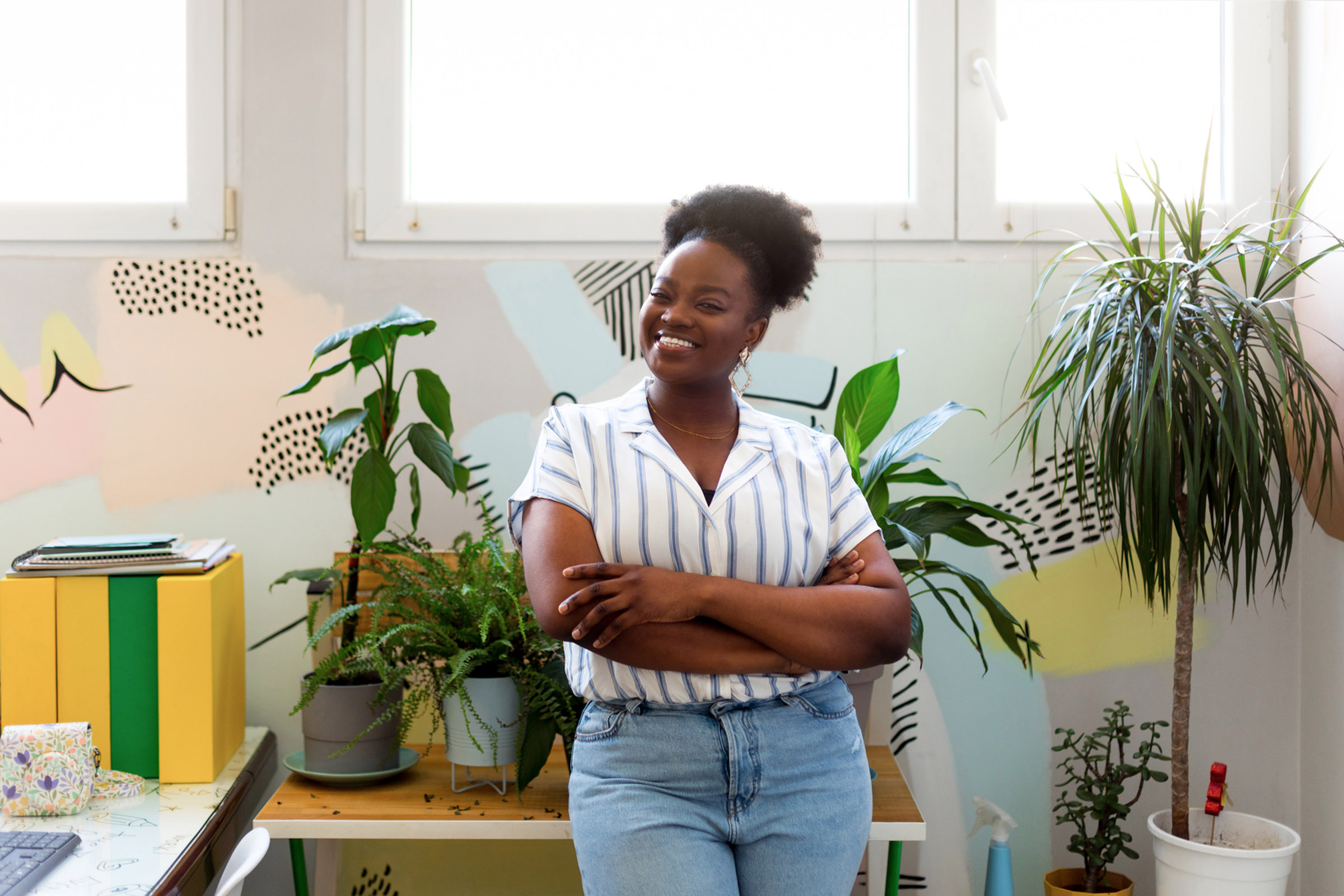 woman in plant filled office