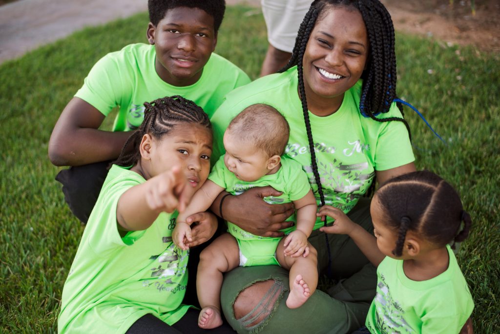 family reunion matching green shirts on grass family reunion matching green shirts on grass